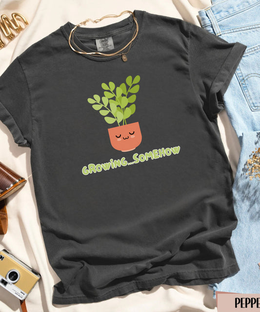 Comfort Colors® “Growing Somehow” Shirt | Cute Plant Graphic Tee, Soft Mental Health Humor, Cottagecore Aesthetic T-Shirt